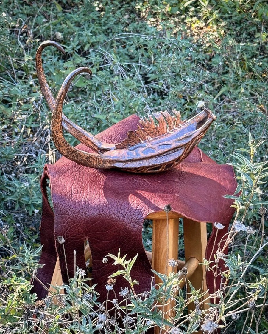 Ceramic sculpture with leather